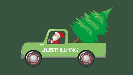 Santa in a pickup truck with a Christmas tree in the back