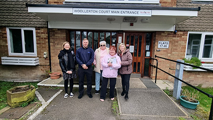 Staff and tenants standing outside of Woollerton Court entrance