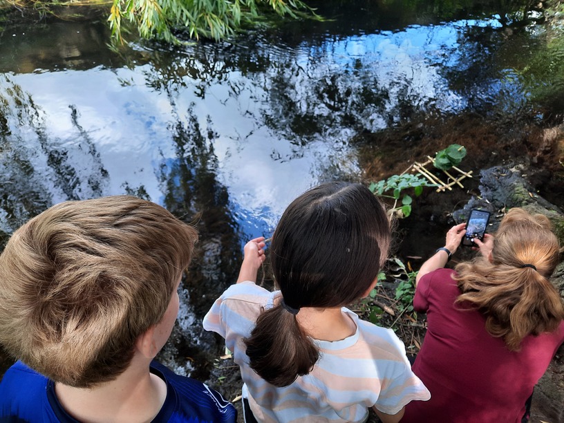 Children waiting at the side of the River Wye, High Wycombe