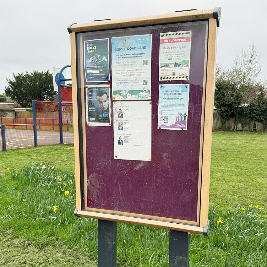 A noticeboard with posters