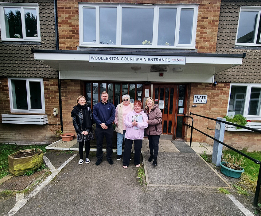 Staff and tenants outside Woollerton Court entrance