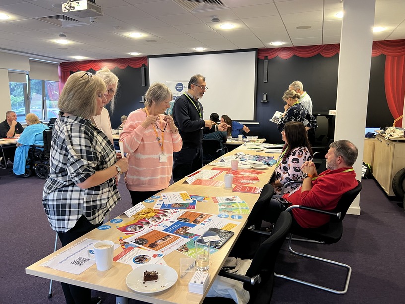 Tenants interacting with organisations at the volunteering opportunities event.