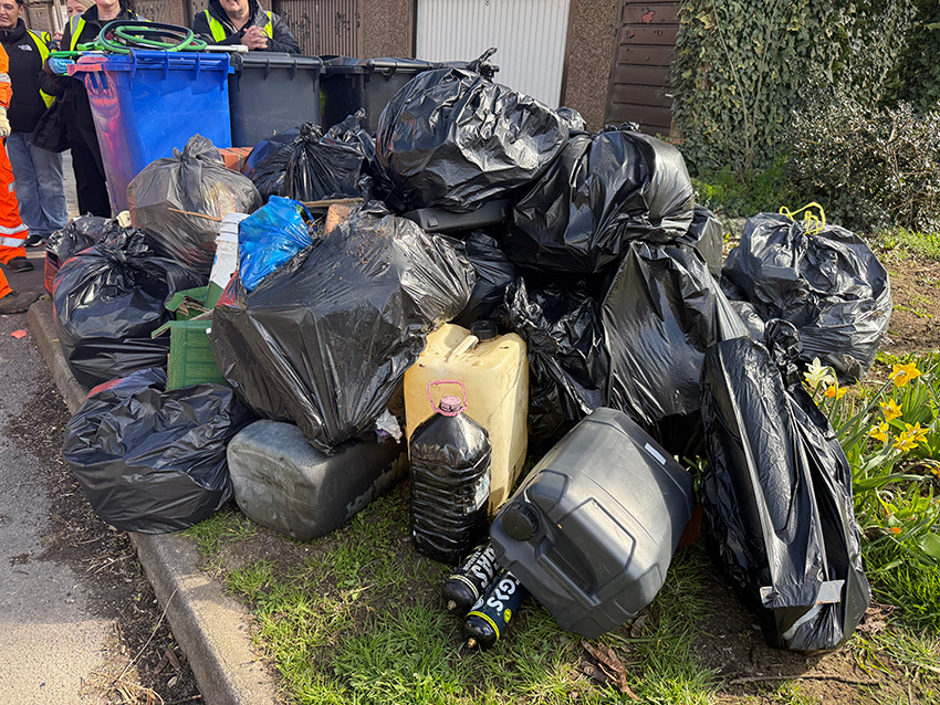 Piled up rubbish bags and litter