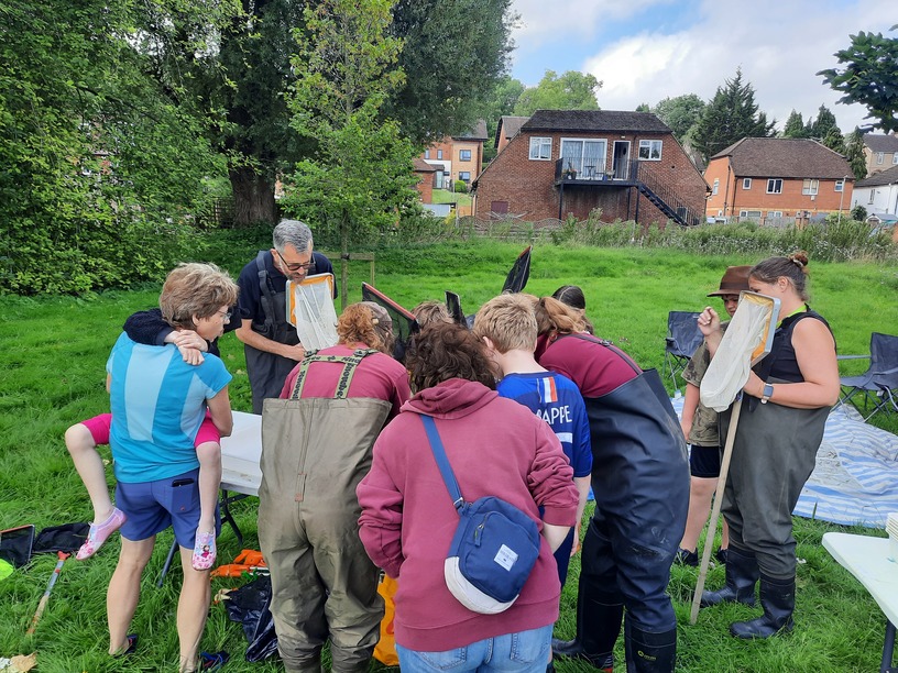 Participants gathered around a table during River Explorer Day