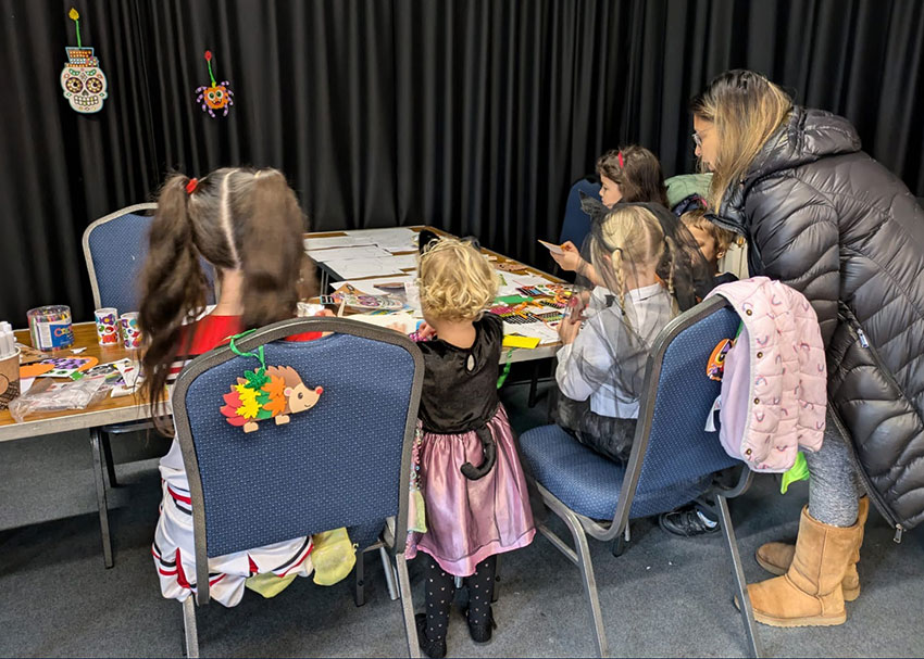 Children and parents enjoying the arts and crafts activities