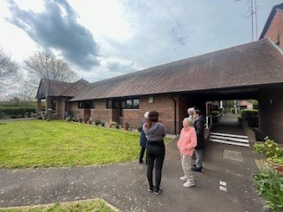 Picture of tenants looking at a potential new Environmental Improvement Group pooject site.