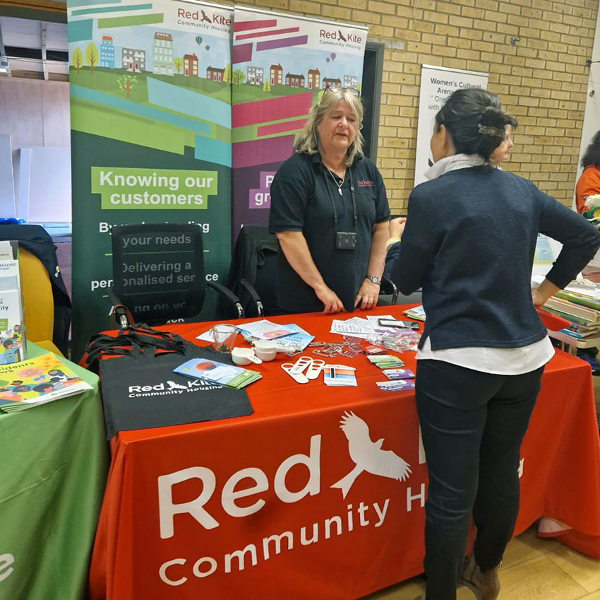 Tracey talking to a local resident at the Castlefield Community Action Day, 29th May 2024