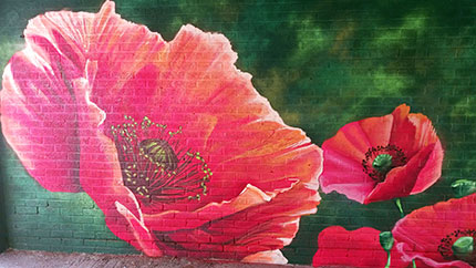 The poppy mural on one side of the Mahoney Court undercroft