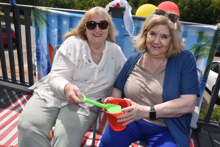 Tenants Posing On Deck Chairs