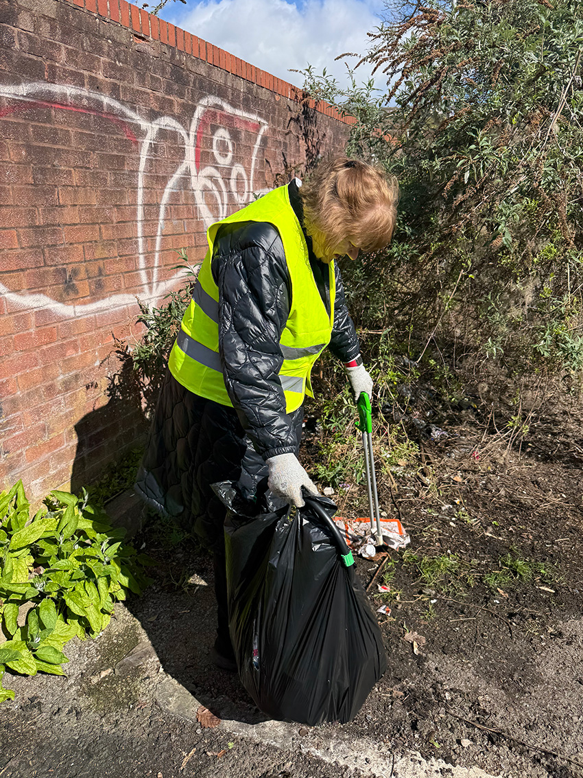 A Red Kite member of staff litter picking