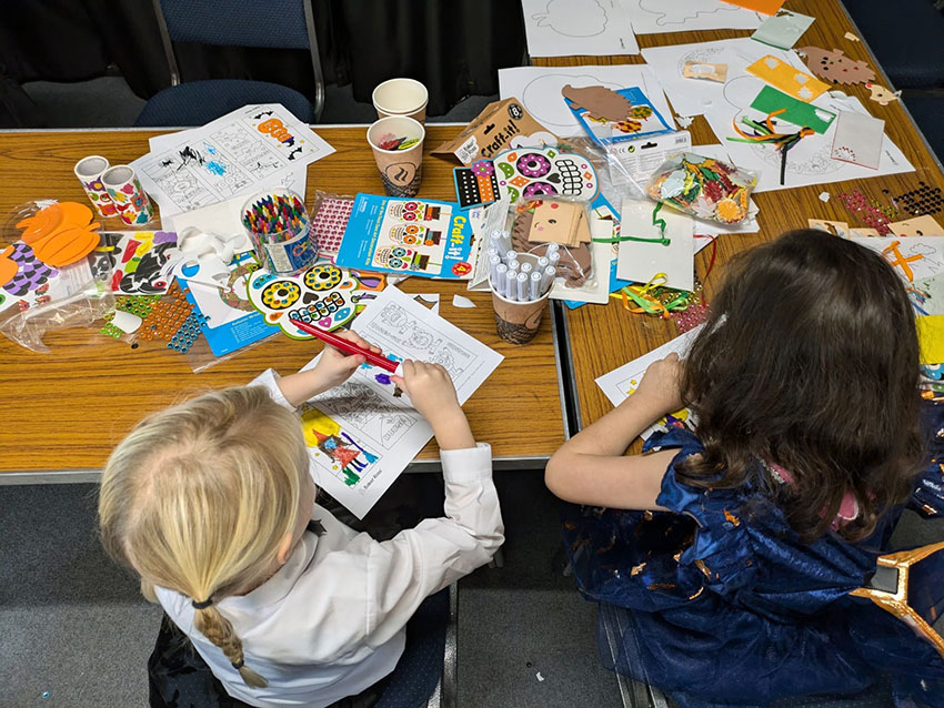 Two children enjoying the arts and crafts activities