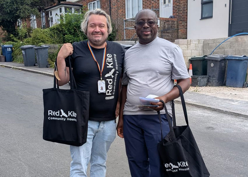 A member of Red Kite staff and a tenant volunteer out visiting tenants