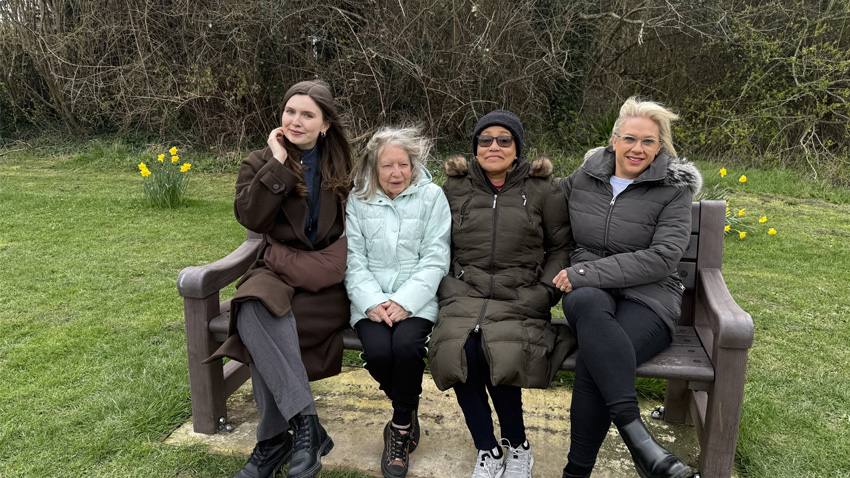 Red Kite Employees And Volunteers Sitting On A Bench Funded By Red Kite