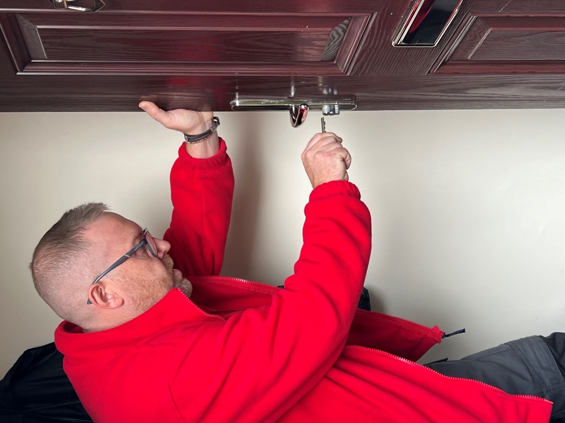 James, a Gilmartins operative, changing a front door lock