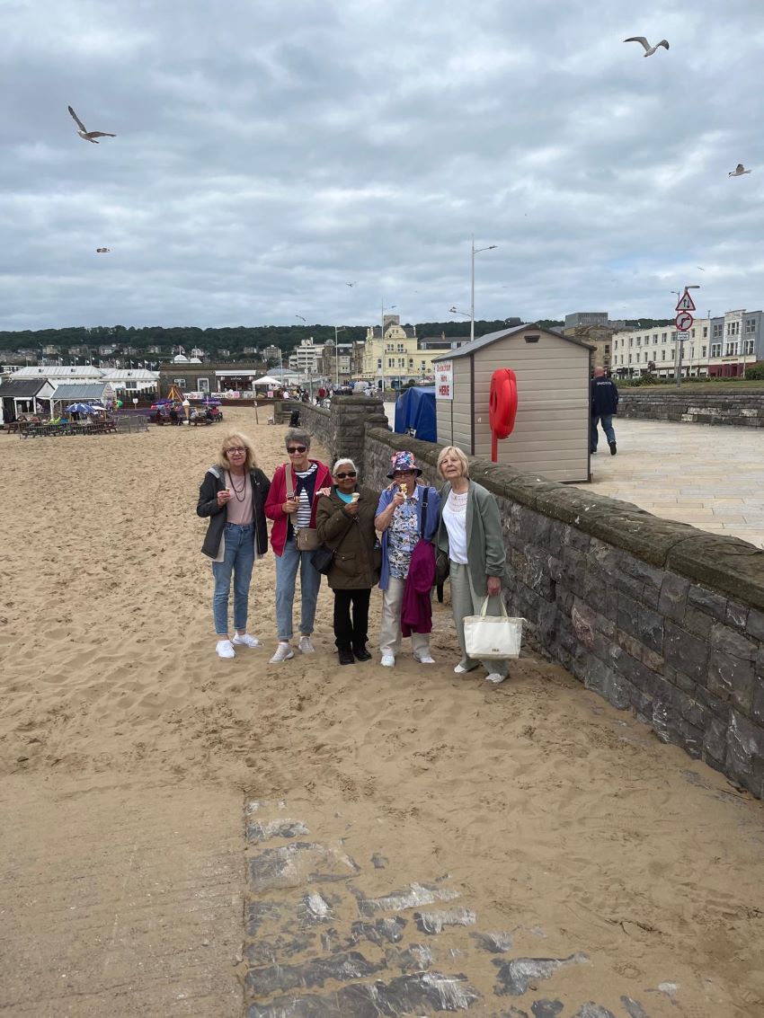 Tenants Enjoying An Ice Cream On The Beach.