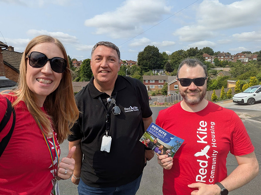 Three members of Red Kite staff out visiting tenants