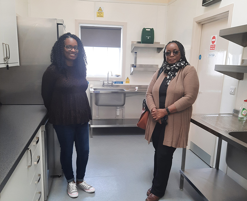 Two ladies standing in the newly renovated Hilltop kitchen