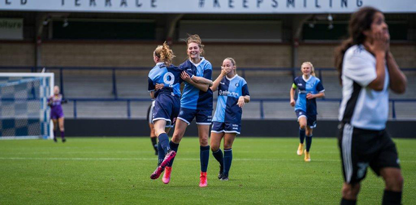 Female football players celebrating a success