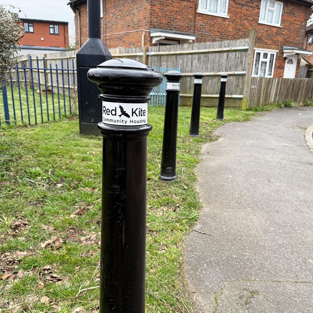 Black Bollards With Red Kite's Logo
