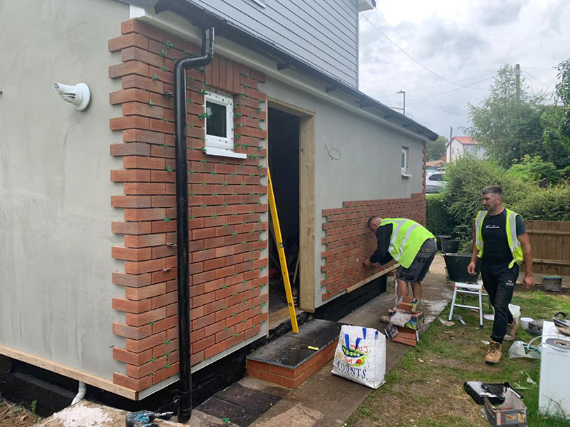 The refurbishment in progress as builders add bricks to the Keens Close homes