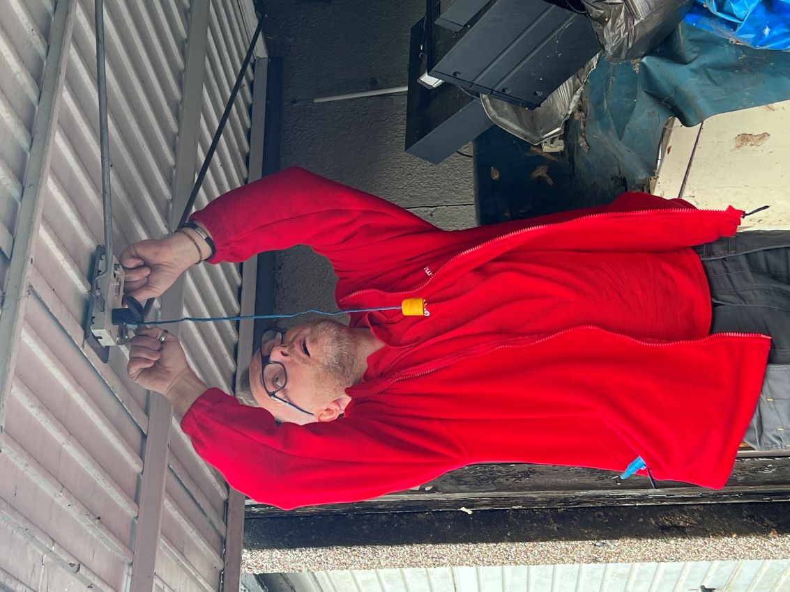 James, a Gilmartins operative, changing a garage lock