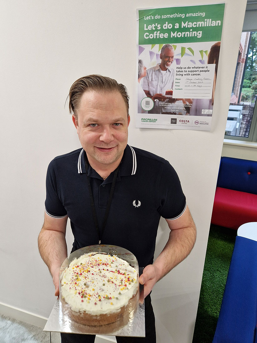 Dan Haynes with a cake at the Red Kite cake sale