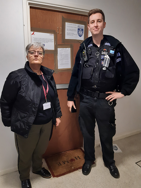 Red Kite and police standing outside of Mahoney flat given a closure order