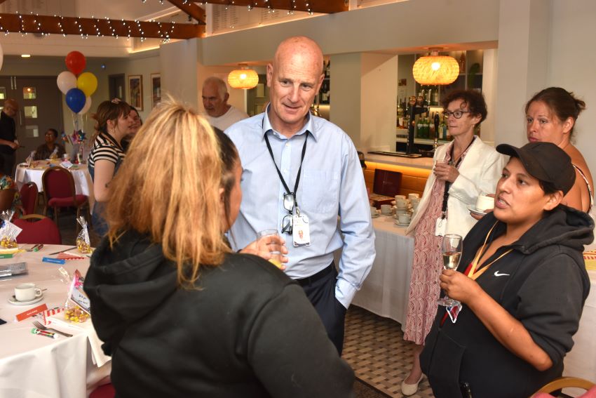 Tenants And Staff Chatting