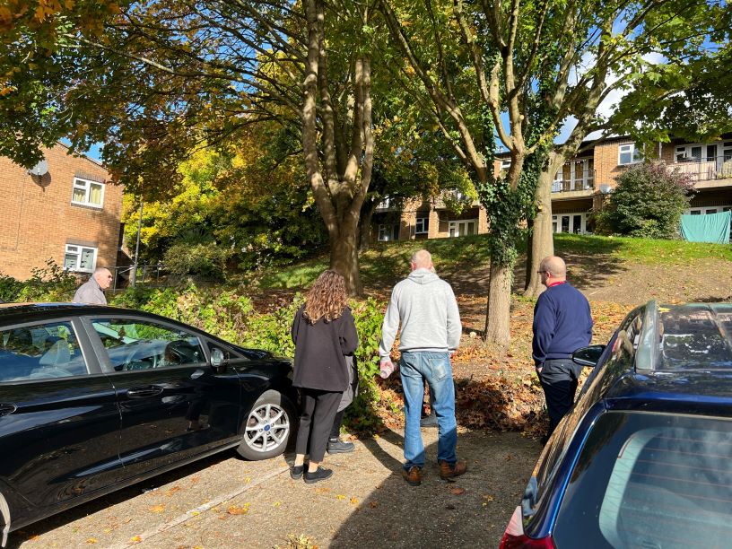 Staff and tenants looking at a potential site at Malvern Close