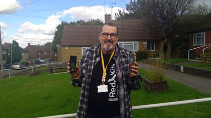 Ron proudly showing off a damp meter and a hygrometer